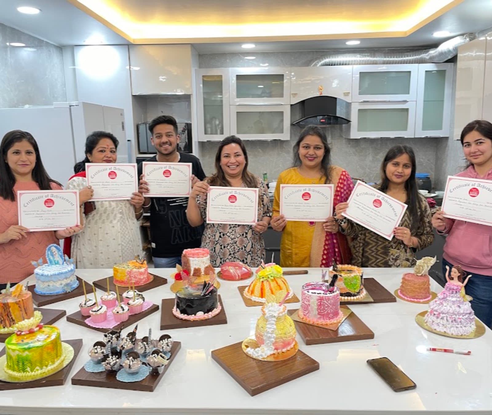 Gauri Creation students celebrating with their course certificates